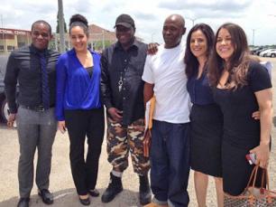 Photo: Nathan Brown (white shirt) with exoneree Michael Williams (black hat) and his legal team. - Innocence Project